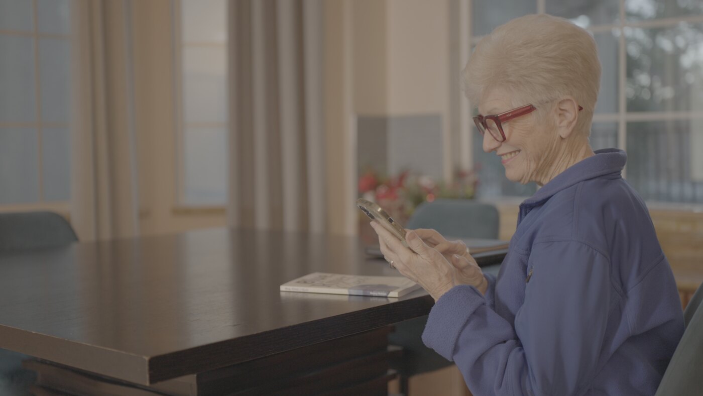 A Moneta member doing her brain training program by phone at home